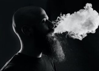 MR Fog Max Pro: The Future of Vaping man smoking with black background
