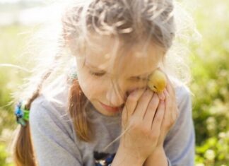 How to Make Your Adoptive Child Feel Welcome and Loved woman in gray long sleeve shirt holding yellow fruit
