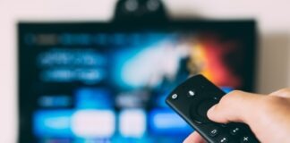 turned-on flat screen television