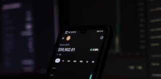 a cell phone displaying a stock chart on the screen