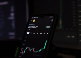 a cell phone displaying a stock chart on the screen