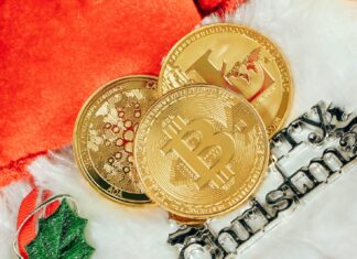 two gold bitcoins sitting next to each other