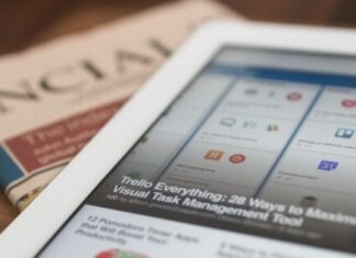Unlock Efficiency and Growth: The Power of Finance Software for Your Company white tablet computer on top of newspaper
