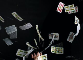 playing cards on black textile