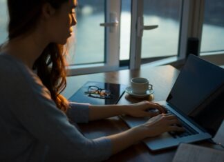 Buying A Home from a Developer: What Should You Know? woman sitting beside table using laptop