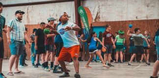 a group of people playing a game of tennis