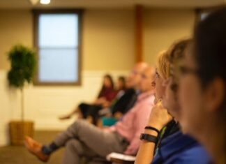 a group of people sitting in a room