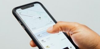 a person holding a cell phone in their hand