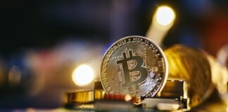 a bitcoin sitting on top of a computer chip