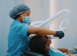 Embracing the Future: The Latest Innovations in Cosmetic Dentistry a woman getting her teeth brushed by a dentist