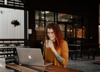 The Most Popular Types of Online Casinos woman in brown long sleeve shirt sitting by the table using macbook