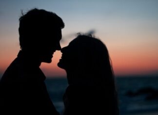 Tips for Keeping Your Relationship Fresh and Exciting silhouette of man and woman about to kiss on beach during sunset