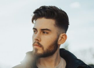 Best Oils for Beard Growth and Thickness man in black zip up jacket