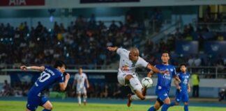 2 men in blue and white jersey shirt playing soccer