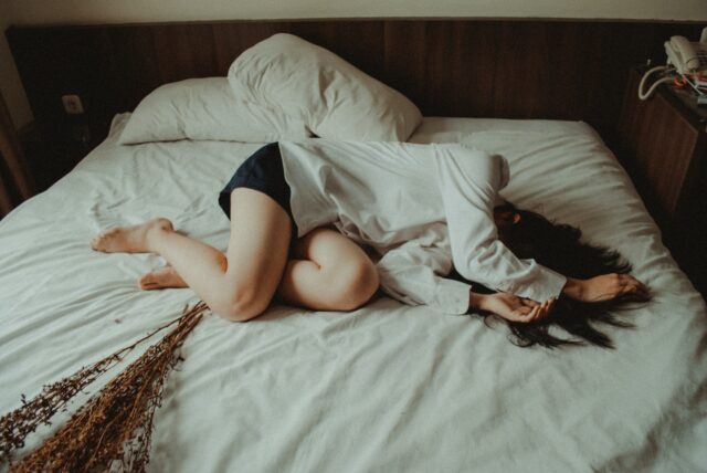 Photo by Yuris Alhumaydy woman lying on bed