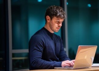 Business Trends: Setting Up a DAO LLC man in black long sleeve shirt using macbook