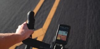 a person riding a bike with a gps app on the handlebars
