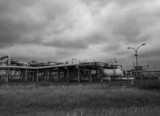 grayscale photo of train on rail tracks