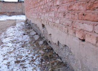 What Should Be Known About Home Water Damage? a brick wall that has been partially covered in snow