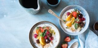 two bowls of oatmeal with fruits
