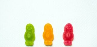 three assorted-colored gummy bears