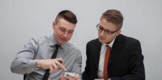 two man watching smartphone