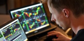 man sitting in front of the laptop