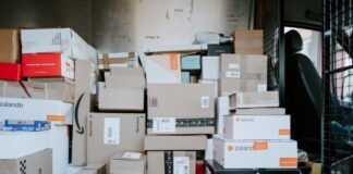 brown cardboard boxes on black plastic crate