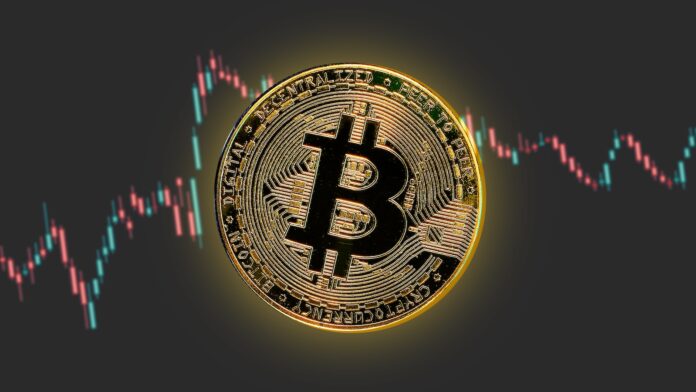 Photo by Yiğit Ali Atasoy a bitcoin is shown in front of a stock chart