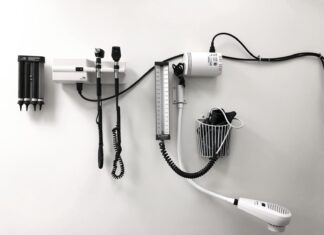 Ear Care 101: Top Ways to Shield Your Hearing a hair dryer and a hairdryer on a wall