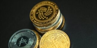 a pile of gold and silver coins sitting on top of each other