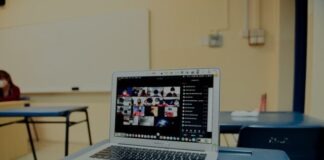 macbook pro on blue table
