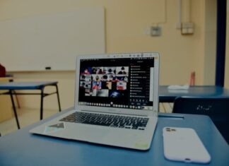 Can I Take Online Classes In Another State? macbook pro on blue table
