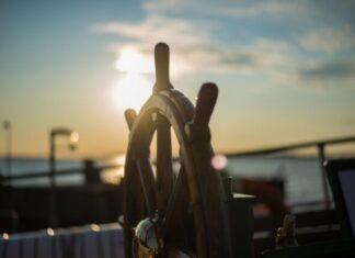 Benefits of Buying a Salvage Boat at An Online Auction brown wooden ship's wheel