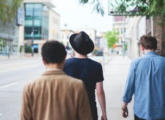 The Testosterone Revolution: Why It’s a Hot Trend in Health three men walking along the street