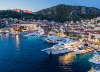 Why You Should Consider a Yacht Charter Vacation white ship on body of water near city buildings during daytime