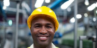 Portrait of smiling factory worker in the factory