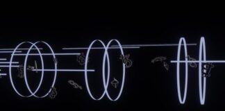 a black wall with a neon light drawing on it