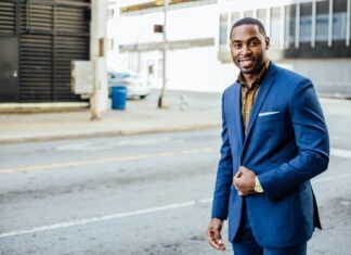 The Future of Adult Tech: A Peek into the Tech-Infused OnlyFans Universe man in blue formal suit