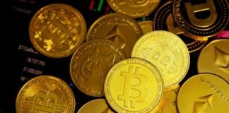 a pile of gold bitcoins sitting on top of each other