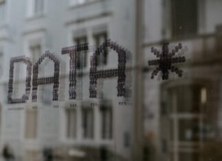 Can Decentralized Identity (DID) Solve the Issue of Data Privacy on the Internet? a close up of a window with a building in the background
