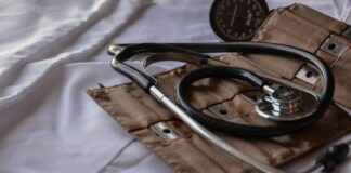 black stethoscope with brown leather case