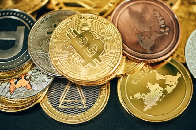 Photo by Traxer a pile of gold and silver bitcoins