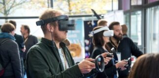 person wearing VR smartphone headset inside room