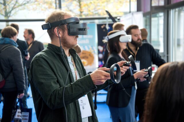 Photo by stephan sorkin person wearing VR smartphone headset inside room