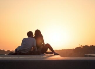 Swinger Etiquette: The Beauty of Respectful and Consent-Centric Interactions couple sitting near trees during golden hour