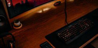 black computer keyboard on brown wooden desk