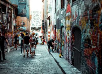 Hidden Gems: Offbeat Experiences in Melbourne man and girl walking beside building