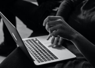 The Gamble of Cybersecurity: Protecting Casino Tech in the Digital Age grayscale photo of person using MacBook