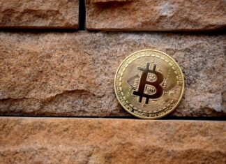 Crypto Staking: Passive Income Opportunities in Proof-of-Stake Networks gold round coin on brown brick wall